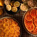 cakes with citrus slices on top