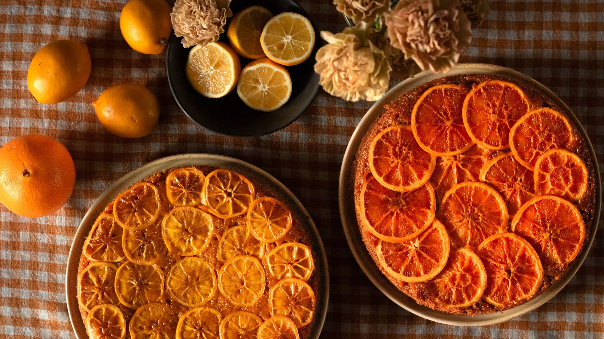 cakes with citrus slices on top