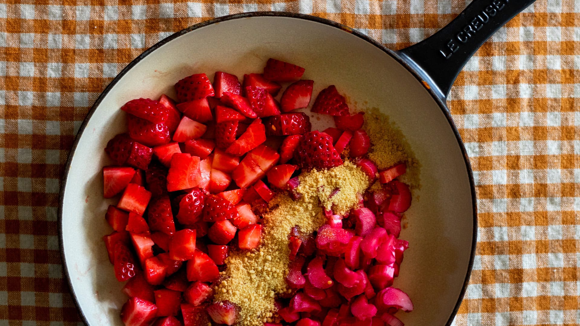 pan with chopped fruit and sugar